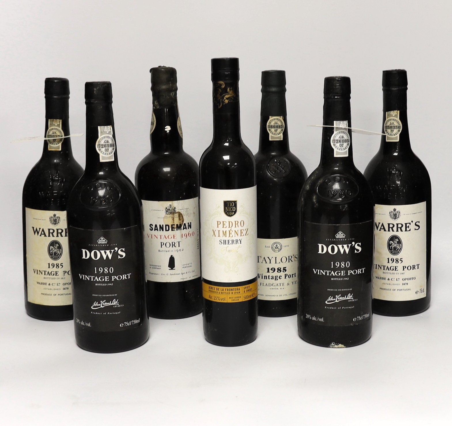 One bottle of Sandeman vintage port 1960, two bottles of Dow’s port 1980, two bottles of Warr’s port 1985, a bottle of Taylors port 1985 and a bottle of Pedro Ximenez sherry (7)